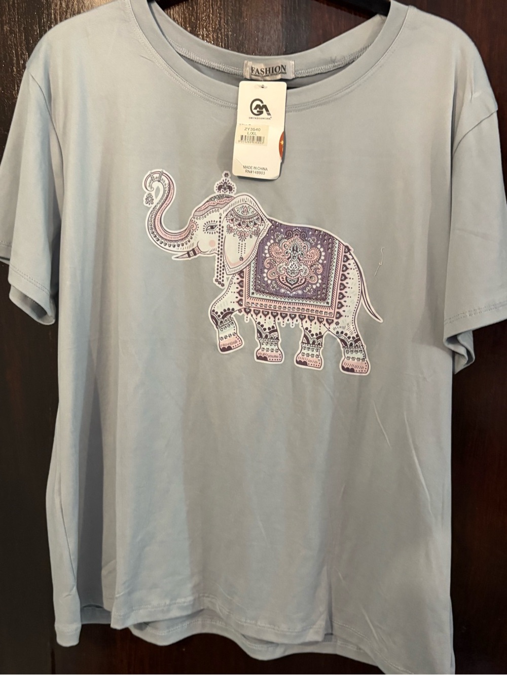 Bundle 3 for $15. NWT  Blue Short Sleeve Tee with Elephant Motif. Size L/XL.